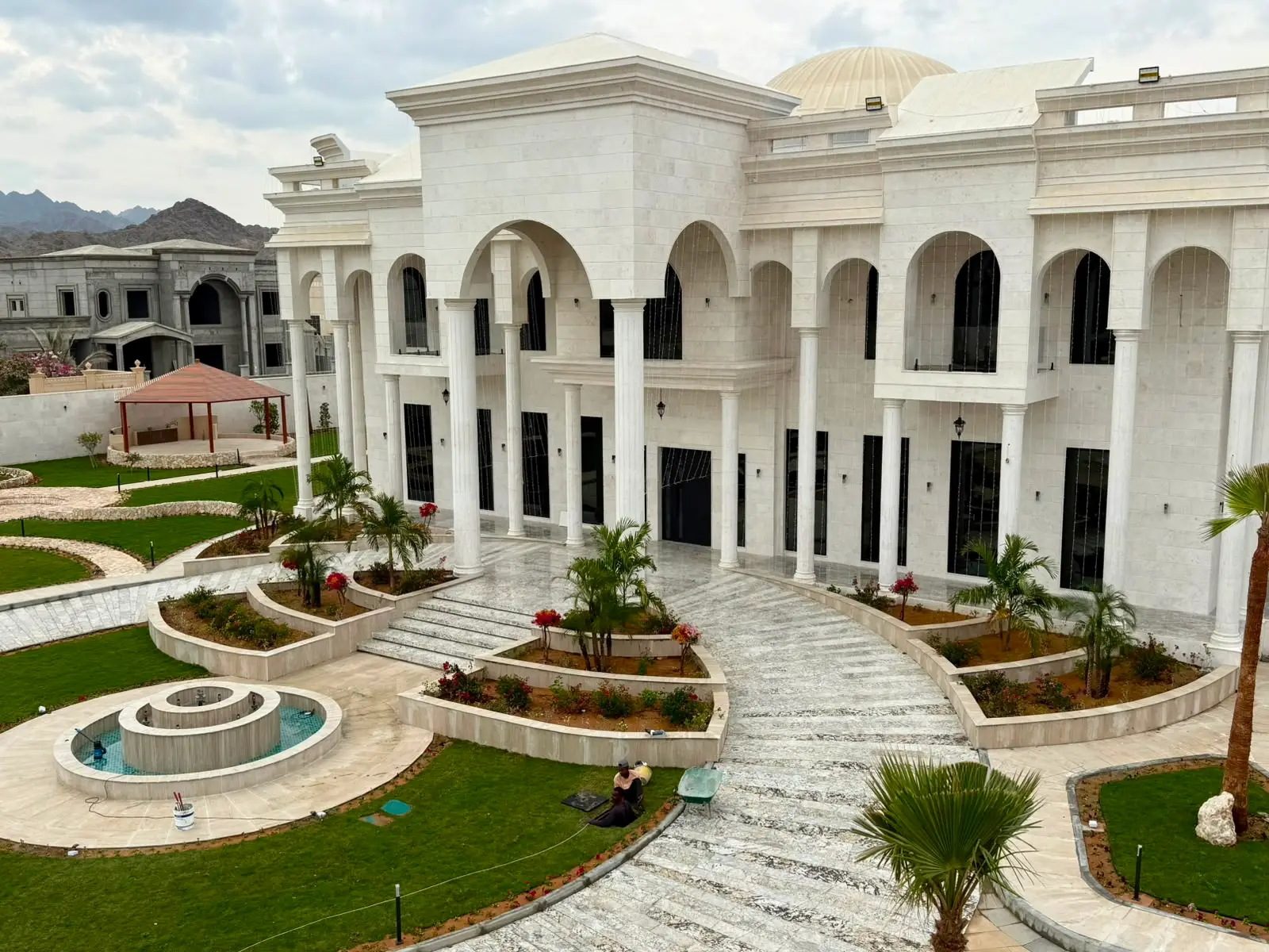 Circular garden fountain water feature at a large property